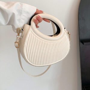 Sac à main de femme nouvelle mode design de niche noir, dame douce de style français pour les déplacements et les rendez-vous, sac à main porté à la main ou en bandoulière, sac à bandoulière rond de mode avec rayures et gaufrage, sacs à main avec double poignée, sacs à main insolites