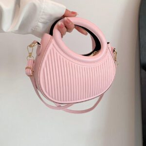 Sac à main de femme nouvelle mode design de niche noir, dame douce de style français pour les déplacements et les rendez-vous, sac à main porté à la main ou en bandoulière, sac à bandoulière rond de mode avec rayures et gaufrage, sacs à main avec double poignée, sacs à main insolites