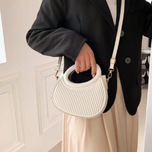 Sac à main de femme nouvelle mode design de niche noir, dame douce de style français pour les déplacements et les rendez-vous, sac à main porté à la main ou en bandoulière, sac à bandoulière rond de mode avec rayures et gaufrage, sacs à main avec double poignée, sacs à main insolites