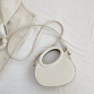 Sac à main de femme nouvelle mode design de niche noir, dame douce de style français pour les déplacements et les rendez-vous, sac à main porté à la main ou en bandoulière, sac à bandoulière rond de mode avec rayures et gaufrage, sacs à main avec double poignée, sacs à main insolites
