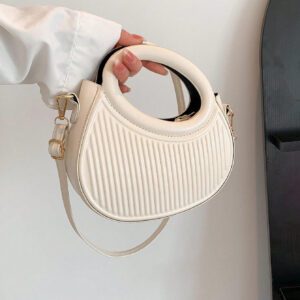 Sac à main de femme nouvelle mode design de niche noir, dame douce de style français pour les déplacements et les rendez-vous, sac à main porté à la main ou en bandoulière, sac à bandoulière rond de mode avec rayures et gaufrage, sacs à main avec double poignée, sacs à main insolites