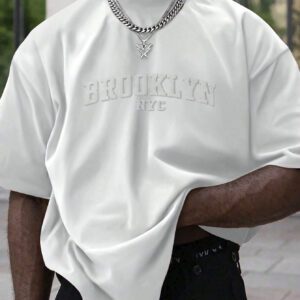 Manfinity Homme T-shirt casual à manches courtes pour hommes en été, col rond, avec impression en relief de lettres. Streetwear
