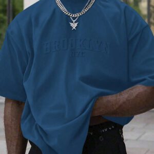 Manfinity Homme T-shirt casual à manches courtes pour hommes en été, col rond, avec impression en relief de lettres. Streetwear