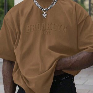 Manfinity Homme T-shirt casual à manches courtes pour hommes en été, col rond, avec impression en relief de lettres. Streetwear