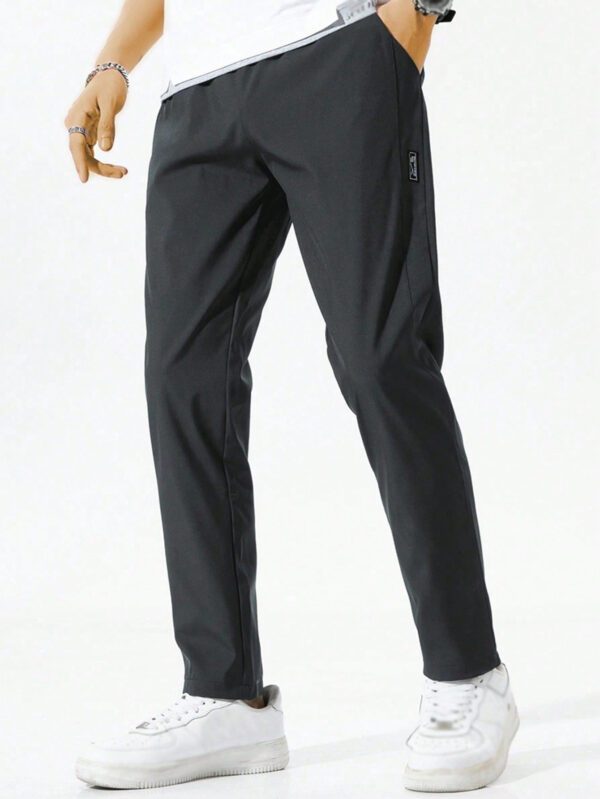 Pantalon pour hommes avec cordon de serrage à la taille et poches zippées, design – Image 8