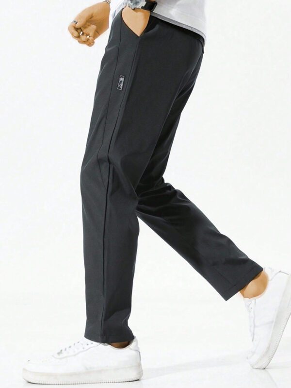 Pantalon pour hommes avec cordon de serrage à la taille et poches zippées, design – Image 9