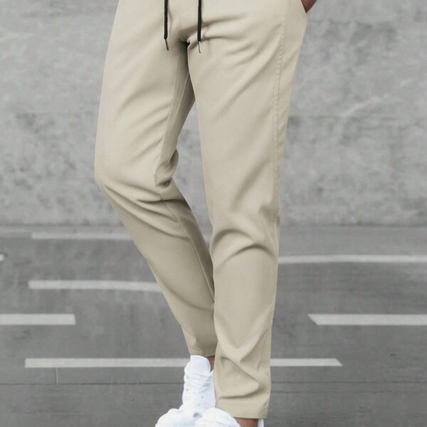 Manfinity Homme Pantalon casual ample et droit avec cordon de serrage à la taille et poches, couleur unie pour hommes