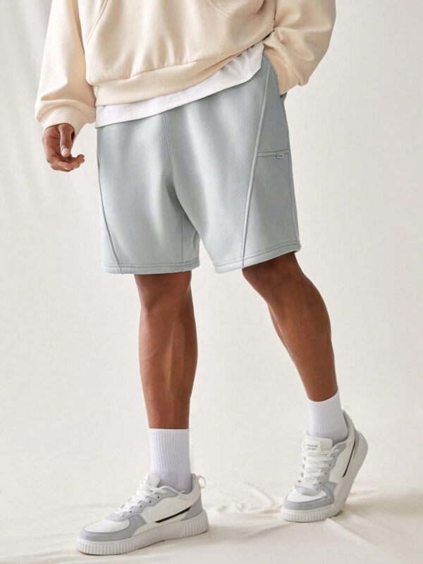 Manfinity UrbanChill Short en maille unie décontracté pour homme avec poches, ample à cordon de serrage jusqu'aux genoux, mode urbaine simple gris clair, cadeau petit ami