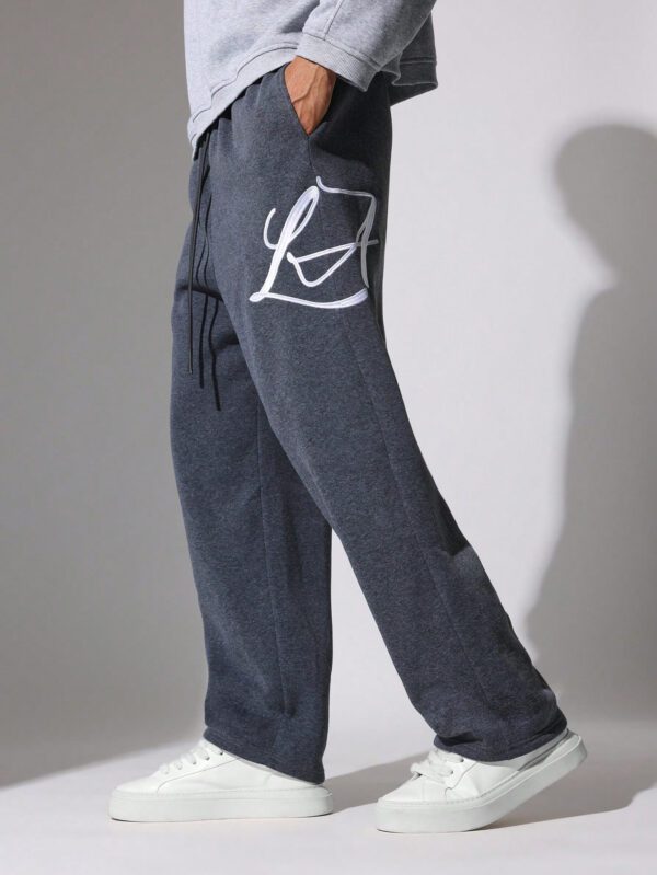 SUMWON Pantalon de survêtement à entrejambe tombante avec cordons et motifs brodés