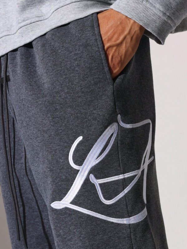 SUMWON Pantalon de survêtement à entrejambe tombante avec cordons et motifs brodés – Image 6