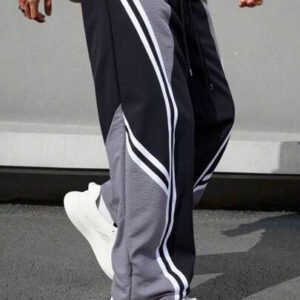 Manfinity EMRG Pantalon décontracté simple et de mode pour hommes, avec un bloc de couleurs. Convient pour l'été