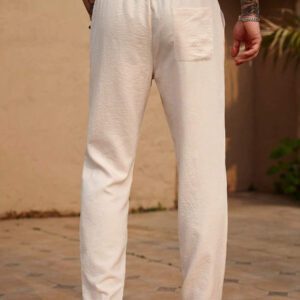 Manfinity RSRT Pantalon décontracté pour hommes, couleur unie, cordon de serrage à la taille, poches inclinées. Pantalon blanc pour hommes. Pantalon décontracté pour hommes