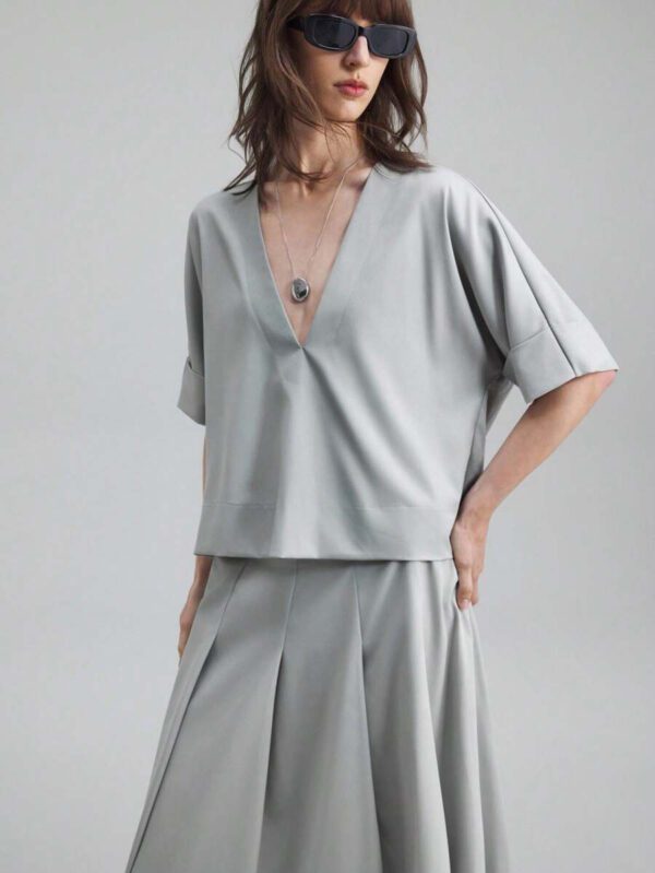 Ontre Tenue décontractée de haute qualité pour femmes d'affaires, comprenant un ensemble deux pièces ample et confortable : un Top à manches dolman col V et une jupe cintrée à la taille avec design de bordure contrastée, convenant pour le bureau, les déplacements et les voyages – Image 12