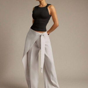 Hauture Blouse ajustée sans manches à la mode avec design de boutons de couleur unie pour femmes